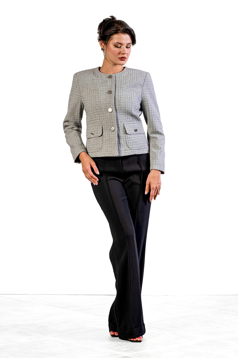 Toni flared trousers in black by Sofia Lara — front view, worn with a grey checked jacket