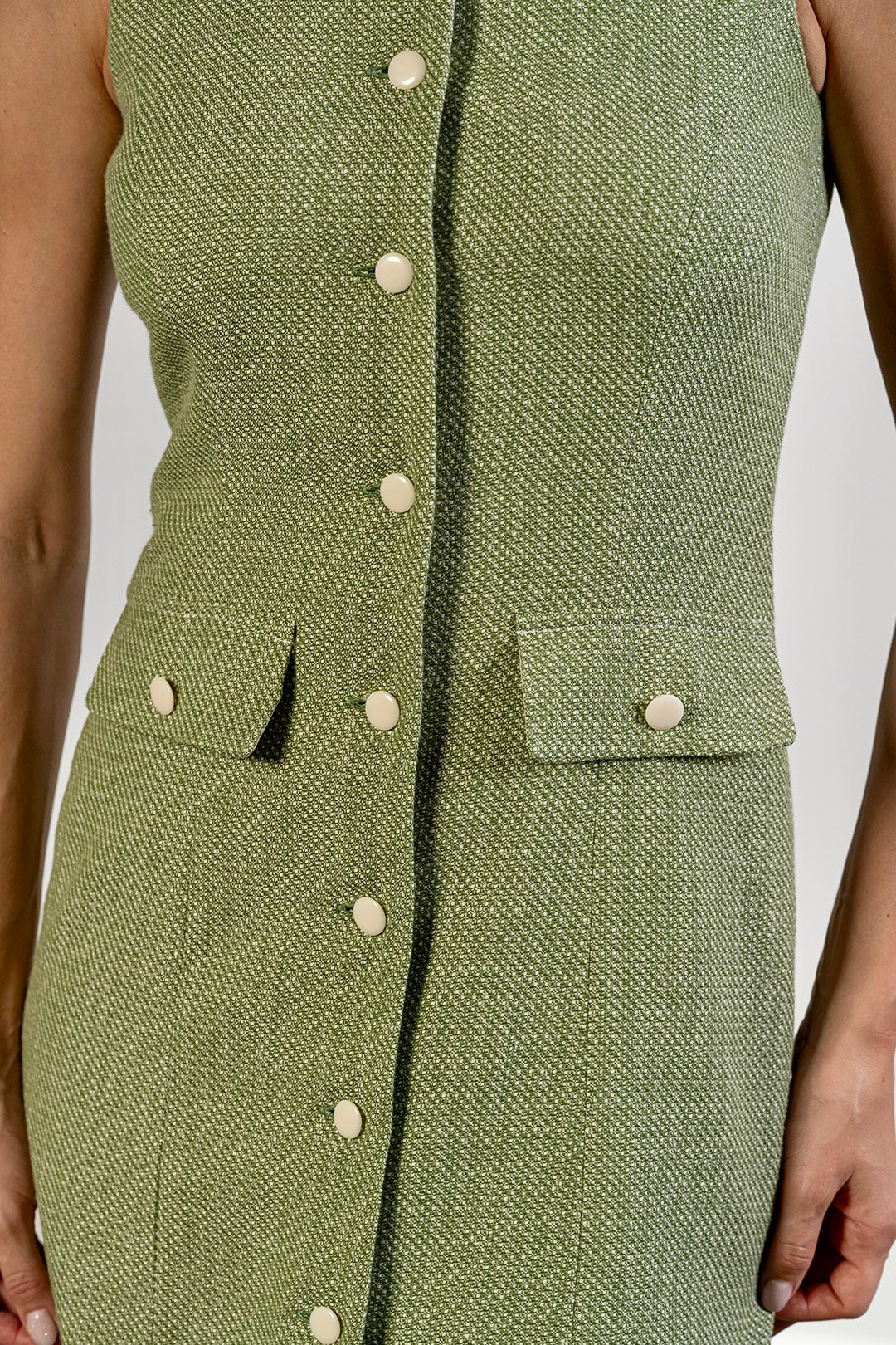 Mira sleeveless dress in sage green textured cotton by Sofia Lara — pocket and button detail