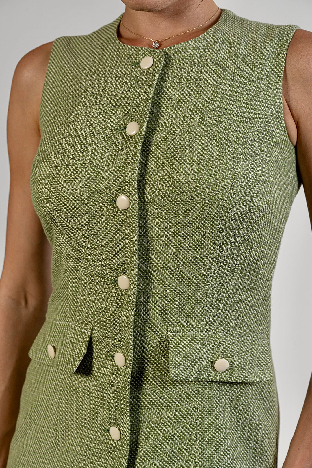 Mira sleeveless dress in sage green textured cotton by Sofia Lara — bodice and button detail