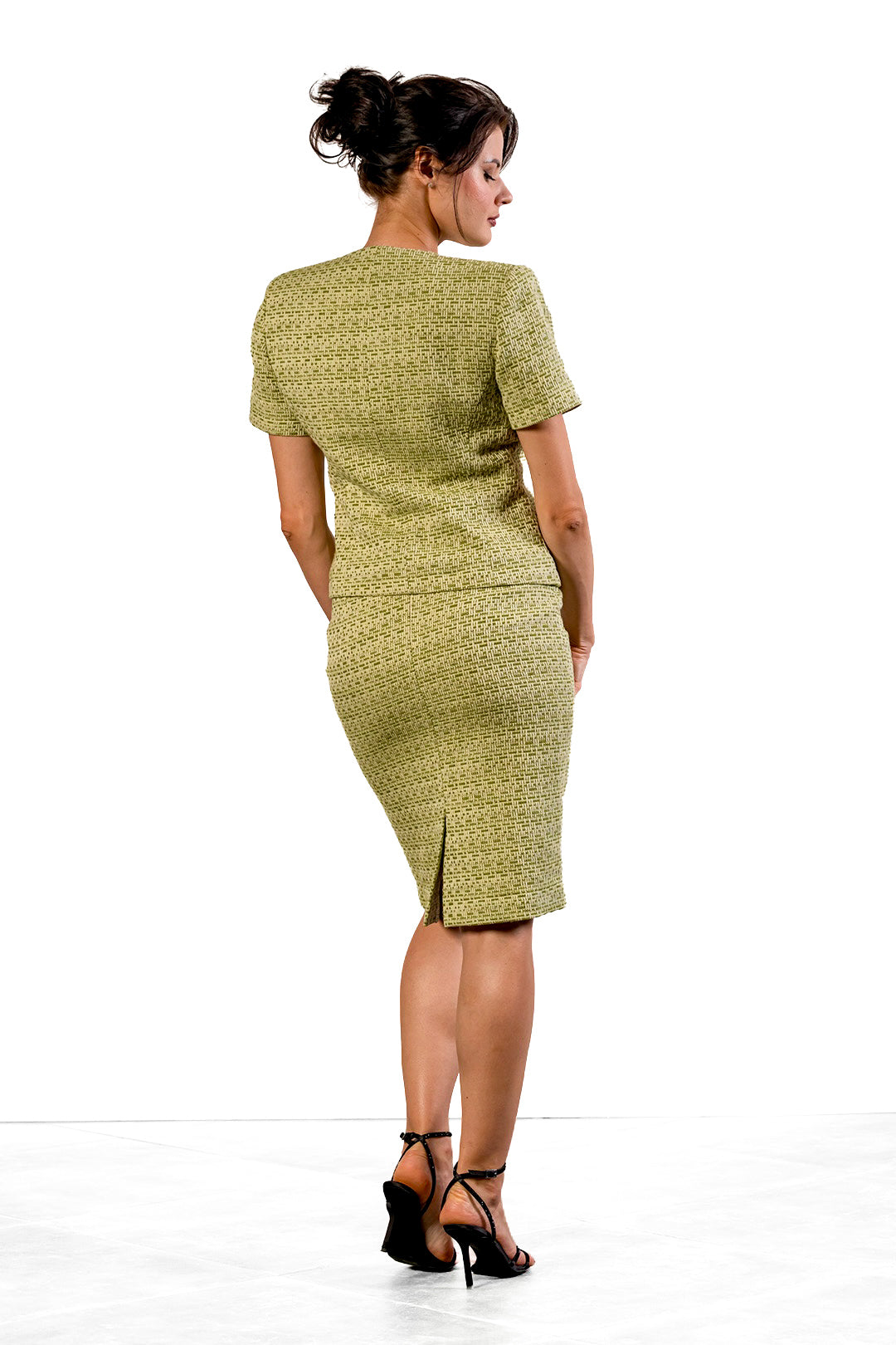 Neli jacket and midi skirt set in pistachio green cotton tweed by Sofia Lara — back view, angled