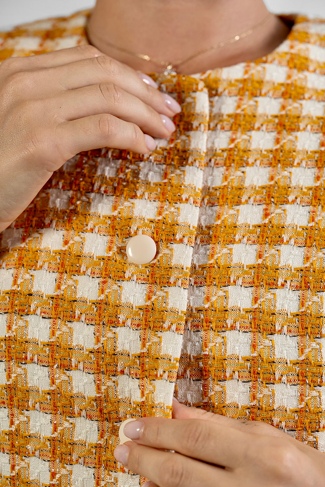 Niya short-sleeved jacket in ochre check cotton tweed by Sofia Lara — fabric and button detail