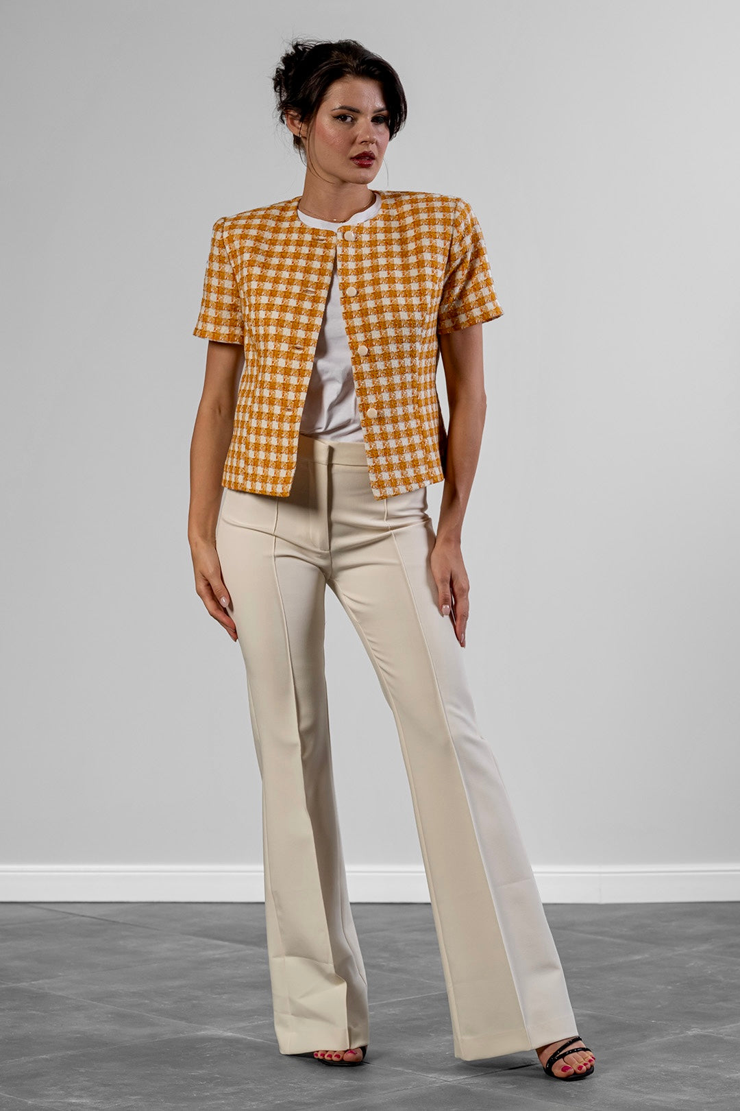 Reni flared trousers in cream by Sofia Lara — full-length front view, worn with the Niya jacket
