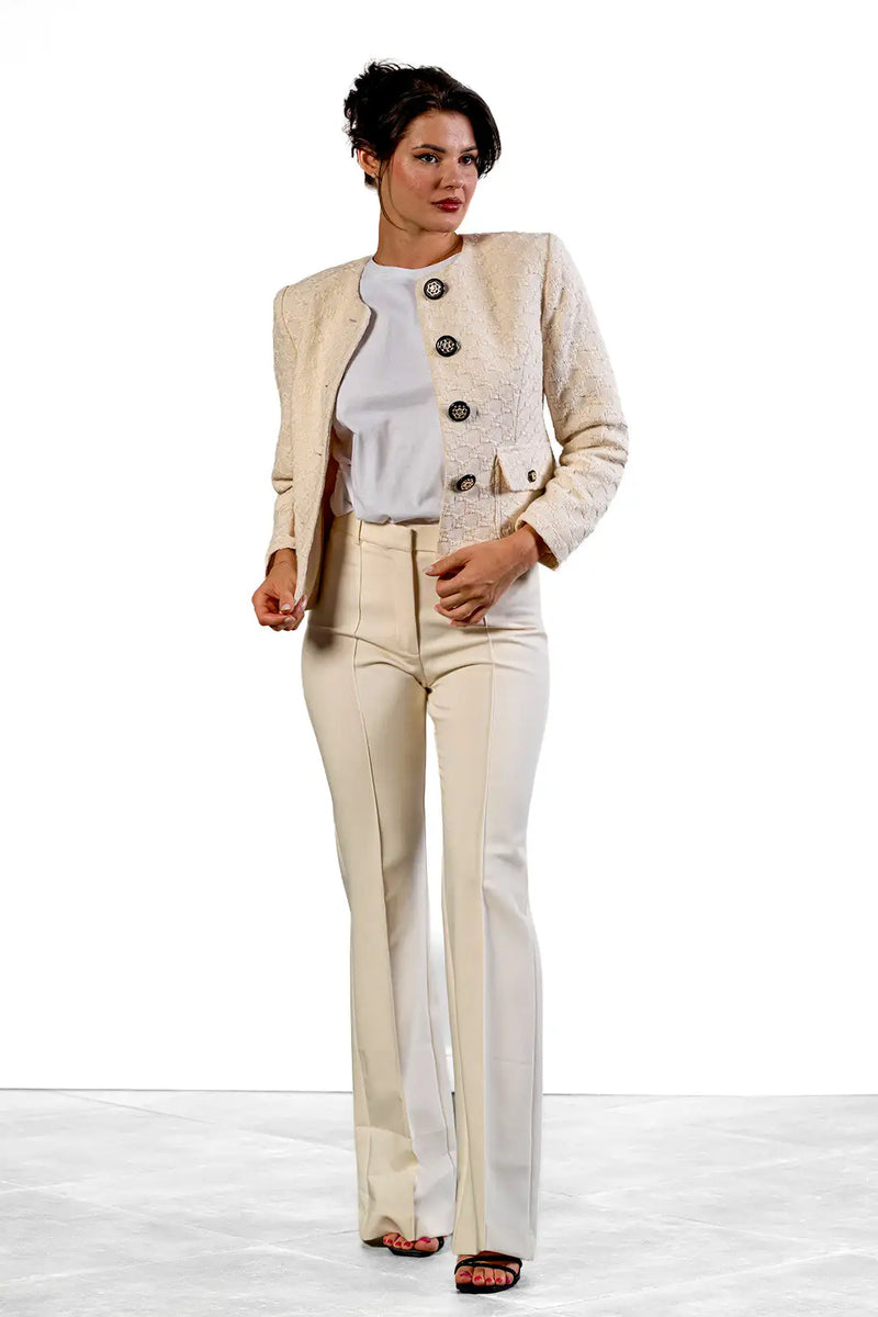 Reni flared trousers in cream by Sofia Lara — front view, worn with a cream bouclé jacket
