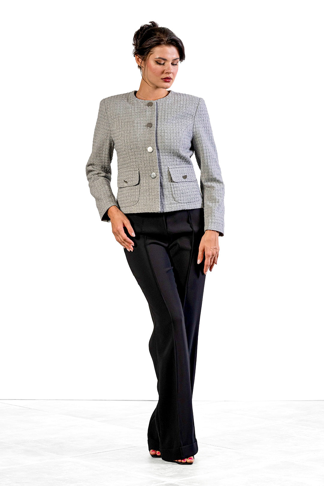 Toni flared trousers in black by Sofia Lara — front view, worn with a grey checked jacket